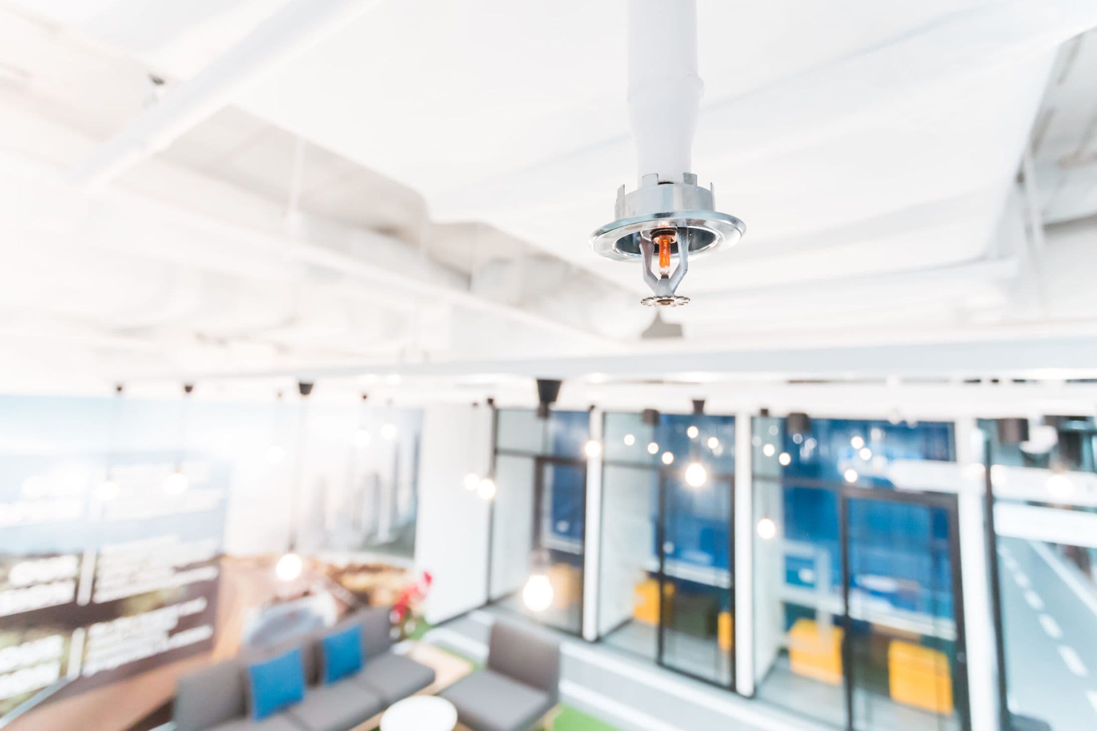 Sprinkler head in a modern open-plan office